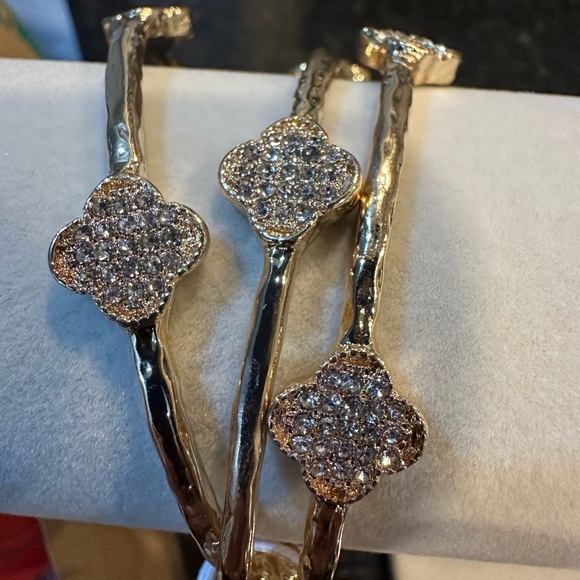 Jewelry - Gold tone bangles with rhinestone clovers